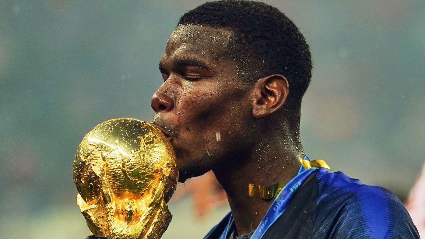 Paul Pogba kisses the World Cup.
