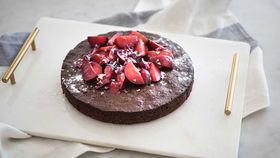 Chocolate cake with stewed blood plums