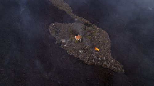 A dormant volcano on a small Spanish island in the Atlantic Ocean erupted on Sunday, forcing the evacuation of thousands of people. 