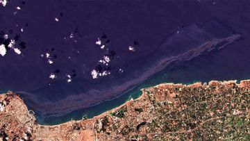 Cypriot authorities say an oil spill that originated from Syria&#x27;s largest refinery is growing and spreading across the Mediterranean Sea.