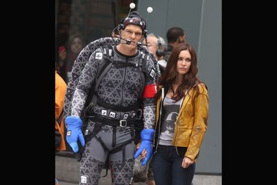 In what may be every '80s childs' wet dream, <i>TMNT</i> sees aliens invading Earth and inadvertently spawning "a quartet of mutated reptile warriors, the Ninja Turtles, who rise up against them to defend the world."<br/><br/>(Image: Megan Fox (April O'Neil) with Alan Ritchson (Raphael) in his CGI turtle costume on the set of TMNT / Splash)