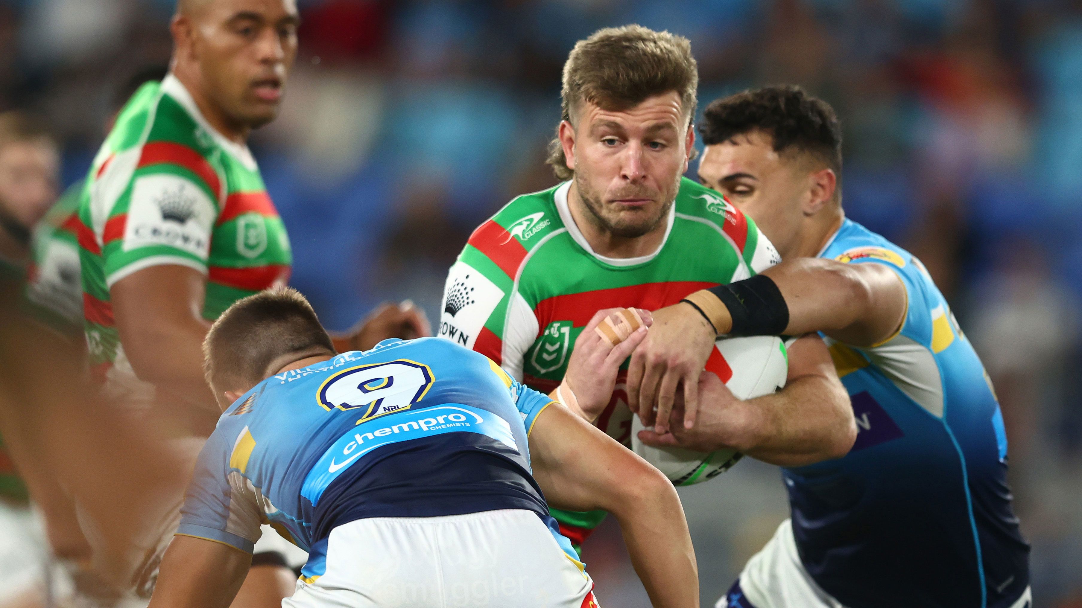 Jai Arrow of the Rabbitohs is tackled during the round 14 match between Gold Coast Titans and South Sydney at Cbus Super Stadium on June 03, 2023 in Gold Coast, Australia. 