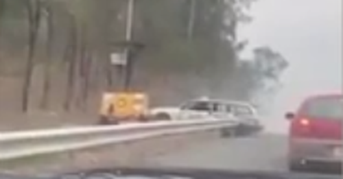 Video posted to Facebook shows a white station wagon ramming a roadside speed camera near Ipswich.