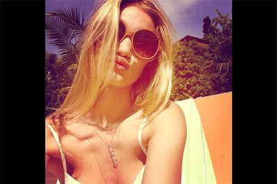 With lips that look like they could suck a doorknob clean off, we imagine that Rosie HW might struggle in her to day-to-day life to <i>not</i> rock a pouty duckface. The young model-turned-designer certainly made the most of her unforgettable mouth in this summer happy snap. <br/><br/><i>Image: Instagram @rosiehw</i>