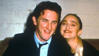 Sean Penn and Madonna relax while attending an AIDS benefit November 11, 1987 in Los Angeles. 