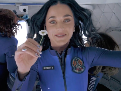 Katy Perry holds up a daisy during her flight to space with Blue Origin, April 2025