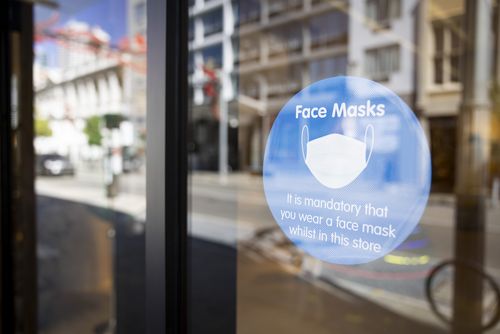 A sign on display advises the public to the requirements of face masks. 