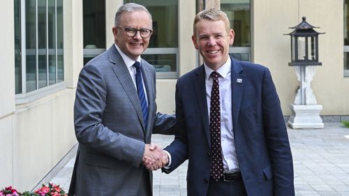 Australian Prime Minister Anthony Albanese welcomes New Zealand Prime Minister Chris Hipkins to Parliament House on Tuesday in Canberra.