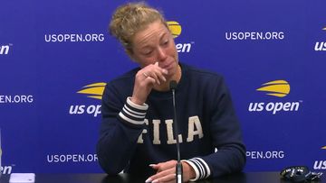 Laura Siegemund wipes away tears in a press conference.