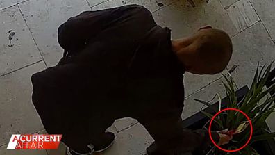 CCTV captured Brian Rapley placing a red rose at the front door.