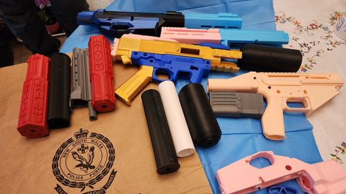 Police allegedly found receivers, slides, magazines and triggers during the search.