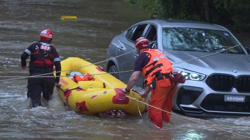 The car got stuck in floodwaters.