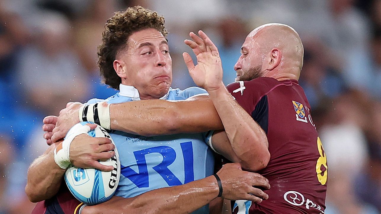 Mark Nawaqanitawase of the Waratahs is tackled during the round three Super Rugby Pacific  against the Reds.