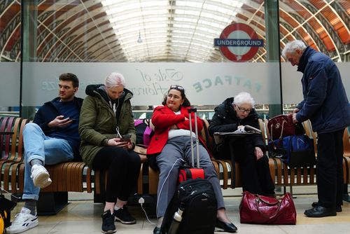 Passengers at Paddington station in London where trains have been cancelled due to Storm Eunice. Millions of people have been urged to stay at home for the day due to safety fears over the impact of Eunice, one of the worst storms to hit the UK in a generation. Picture date: Friday February 18, 2022. PA Photo. See PA story WEATHER Storms. Photo credit should read: Victoria Jones/PA Wire