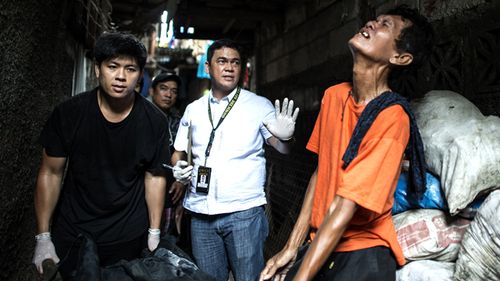 The grieving father of a suspected drug user killed by the police in Manila. Two were captured alive, one died. 
