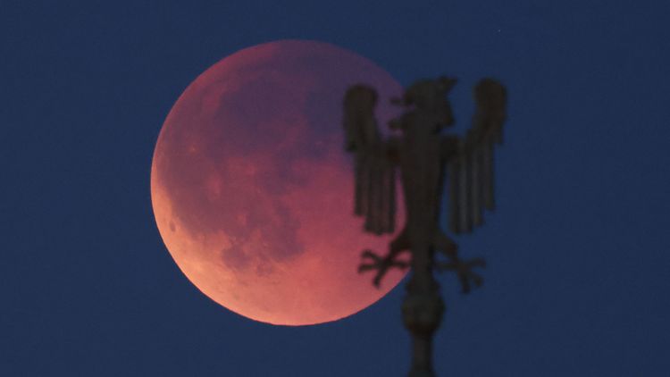 Total lunar eclipse appearing as a red Blood Moon in the night sky