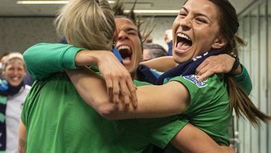 Australian soccer players Steph Catley, Alanna Kennedy and Lydia Williams react as FIFA announced Australia as the hosts to the 2023 FIFA Women's World Cup.