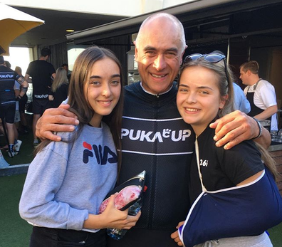 Wayne Schwass with his twin daughters who are 17.