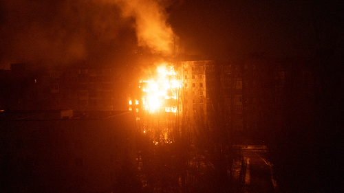 A fire burns at an apartment building after it was hit by shelling in Mariupol, Ukraine, Friday, March 11, 2022. 