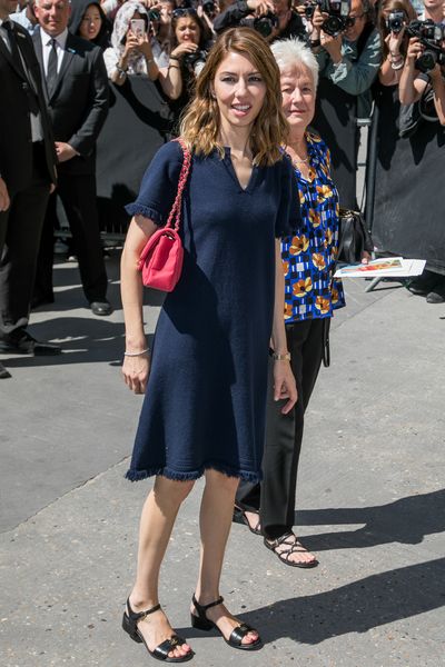 An understated Sofia Coppola in a simple Chanel tunic at the Chanel haute couture show, Paris.