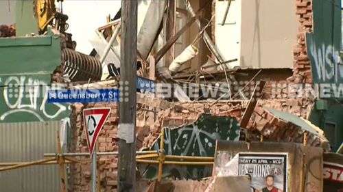 A wall has collapsed this morning from the former Royal Park Hotel. (9NEWS)