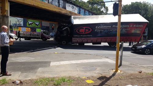 Truck wedged under Melbourne CBD overpass