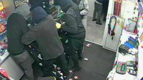 The offenders took armfuls of cigarettes from the service station shelves. (Victoria Police)