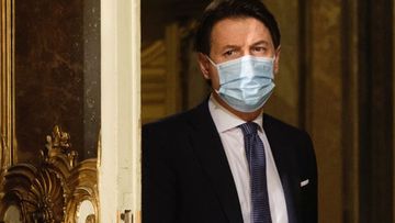 Italian Premier Giuseppe Conte arrives for a press conference at Palazzo Chigi in Rome, Italy, Friday, Dec. 18, 2020