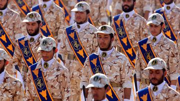 Iranian revolutionary guard soldiers march during the 2013 annual military parade marking the Iraqi invasion in 1980, which led to an eight-year-long war.