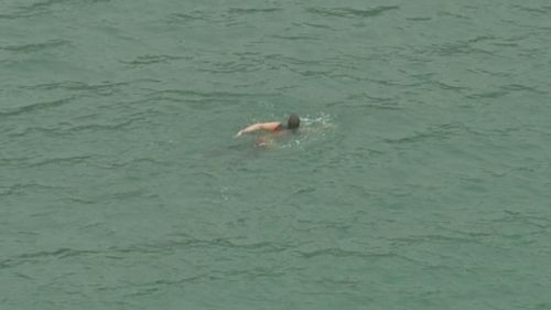The man allegedly attempted to evade police by swimming away. (9NEWS)