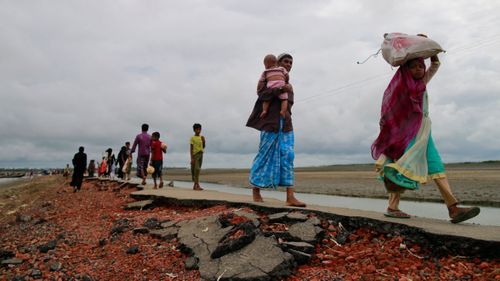 At least 18,500 Rohingya have fled after Myanmar's security forces started attacking civilians. (AAP)
