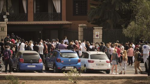 Hotel workers queue to get tested at the H10 Costa Adeje Palace hotel in the Canary Island of Tenerife, Spain.