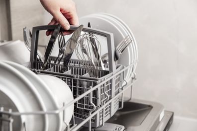 Packing a dishwasher stock pic