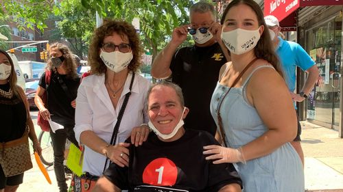 Larry Kelly pictured with his wife and daughter after being released from hospital. 