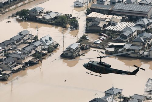 Helicopters and boats were brought in to rescue people from rooftops. Picture: AP