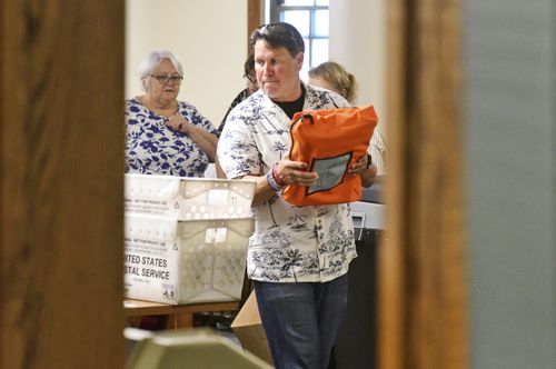 Cambria County election officials work to tally uncounted ballots at the Cambria County Courthouse in Ebensburg, Pa., Wednesday, Nov. 6, 2024. 