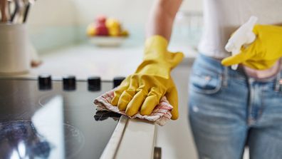 Kitchen cleaning, wiping the bench