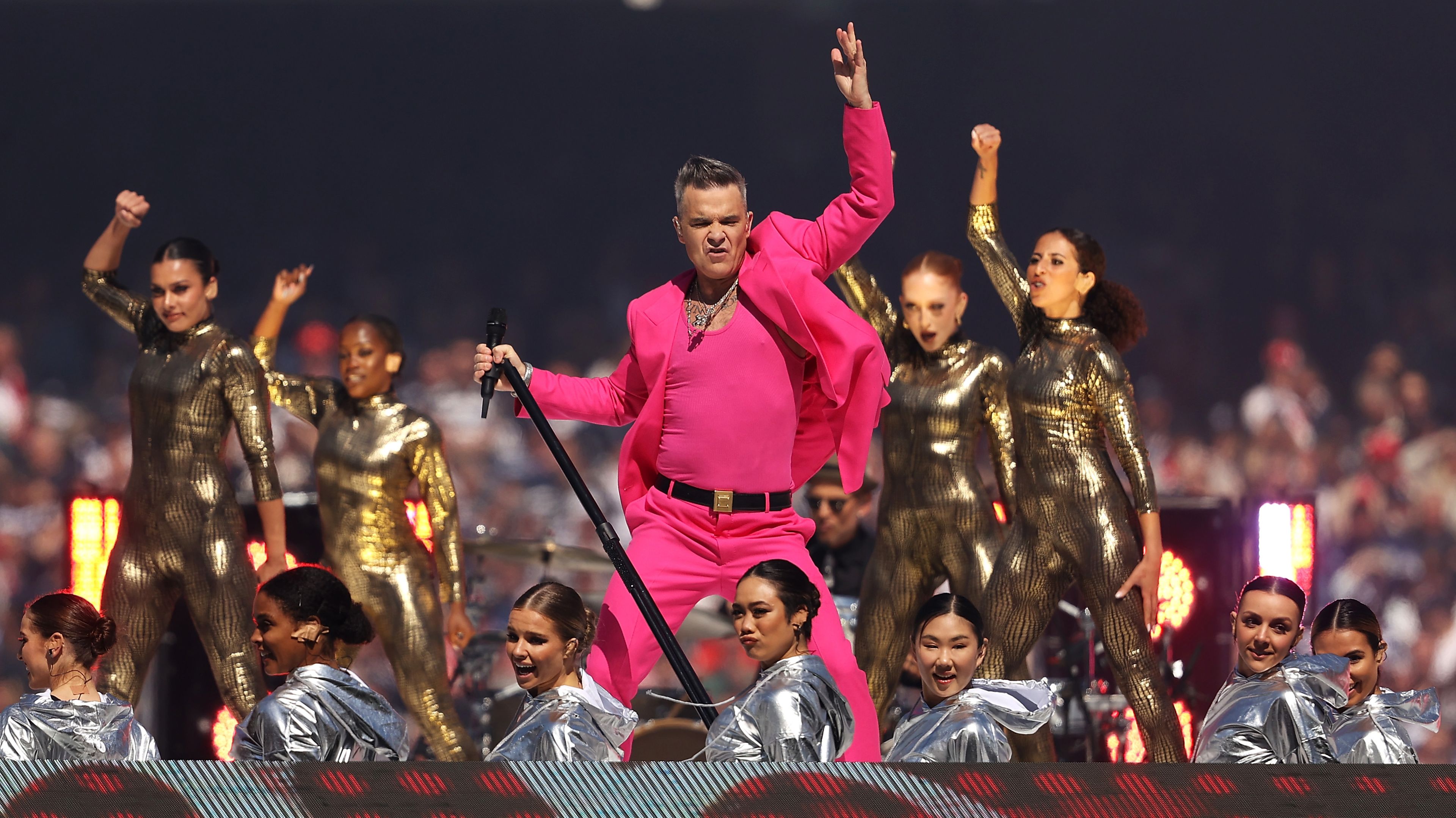 Robbie Williams performs in the pre-game entertainment before the 2022 AFL Grand Final match between the Geelong Cats and the Sydney Swans at the Melbourne Cricket Ground on September 24, 2022 in Melbourne, Australia. (Photo by Mark Kolbe/AFL Photos/via Getty Images)