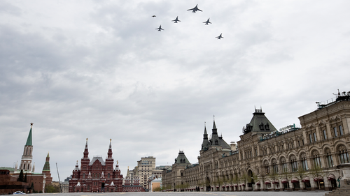 bombers, Tu-160, right, and Tu-22M3, all others, fly over almost empty Red Square in Moscow, Russia, Monday, May 4, 2020. The Russian air force conducted a rehearsal of the flyover intended to mark the 75th anniversary of the victory over the Nazis on May 9, but the planned military parade is postponed due to the coronavirus outbreak, leaving only the flyby. (AP Photo/Alexander Zemlianichenko)