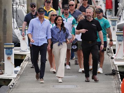 Prince Harry, Duke of Sussex and Meghan, Duchess of Sussex walk and talk with Michael Hartung, CEO of Invictus Australia after taking part in a sailing event with Invictus members in Sydney Harbour, on day four of the royal trip on April 17, 2026 in Sydney, Australia. 