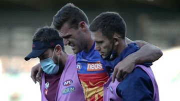 LAUNCESTON, AUSTRALIA - AUGUST 01:Jack Payne of the Lions leaves the field injured during the 2021 AFL Round 20 match between the Hawthorn Hawks and the Brisbane Lions at UTAS Stadium on August 1, 2021 in Launceston, Australia. (Photo by Grant Viney/AFL Photos)