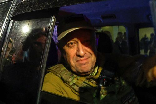 Yevgeny Prigozhin looks out from a military vehicle on a street in Rostov-on-Don, Russia