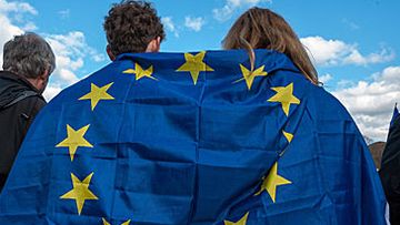 Couple under EU flag (Getty)