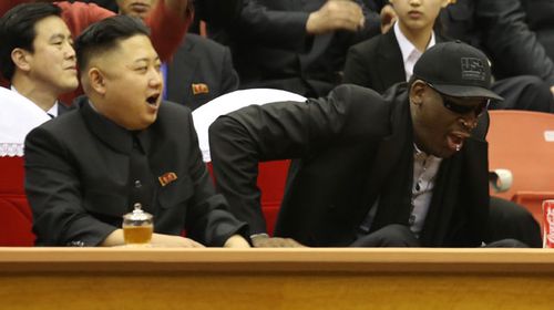 North Korean leader Kim Jong Un and former NBA star Dennis Rodman watch North Korean and US players in an exhibition basketball game. (AAP)