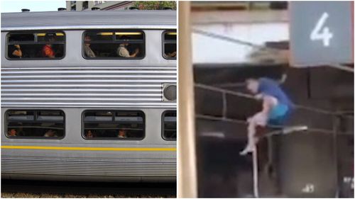 Man filmed holding overhead train wires in Redfern