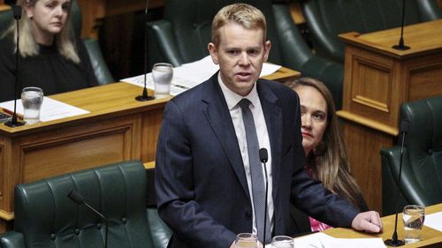 New Zealand Prime Minister Chris Hipkins delivers his statement to Parliament on the first day of the house sitting after the summer recess in Wellington, New Zealand, Tuesday, Feb. 21, 2023. Hipkins says the nation needs to rebuild more resilient infrastructure in the aftermath of last week's cyclone to cope with more frequent and intense weather events. (Jed Bradley/NZ Herald via AP)Alt
