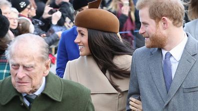 The Duke and Duchess of Sussex walking with Prince Philip in 2017.