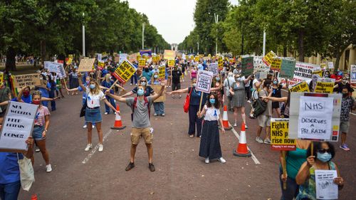 Healthcare workers take part in a protest over pay conditions in the NHS on August 8, 2020 in London, United Kingdom