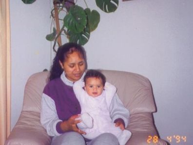 Sapphire Mitchell as a baby in her mum's lap.