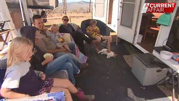 Foxtel install sees family forced to live in caravans